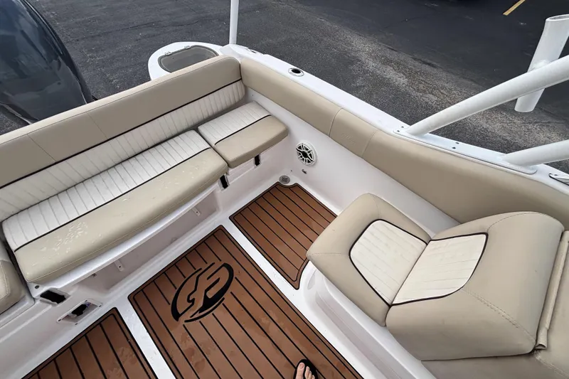 Slide: The Image of Interior of 2019 Sea Fox 226 Traveler boat with beige seating and wood-style flooring. - 21
