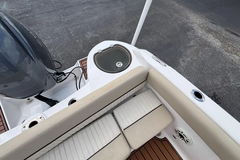 Slide: The Image of 2019 Sea Fox 226 Traveler boat interior with seating and motor detail. - 24