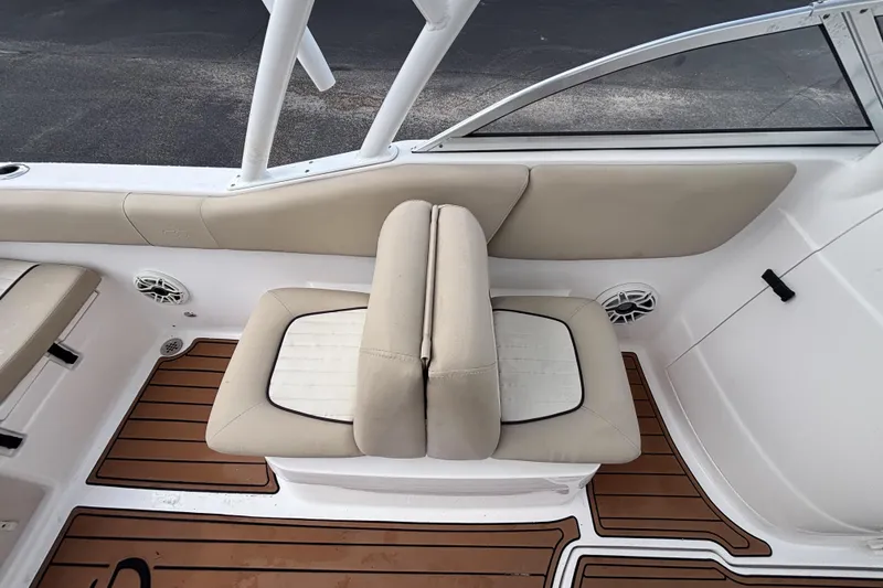 Slide: The Image of 2019 Sea Fox 226 Traveler boat interior with beige seating and teak-style flooring. - 25
