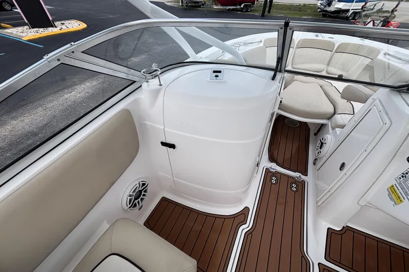 Slide: The Image of 2019 Sea Fox 226 Traveler boat interior with cushioned seating and wood-style flooring. - 26