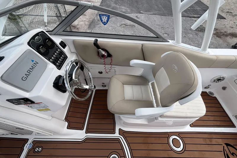Slide: The Image of 2019 Sea Fox 226 Traveler boat cockpit with Garmin navigation and cushioned seating. - 28