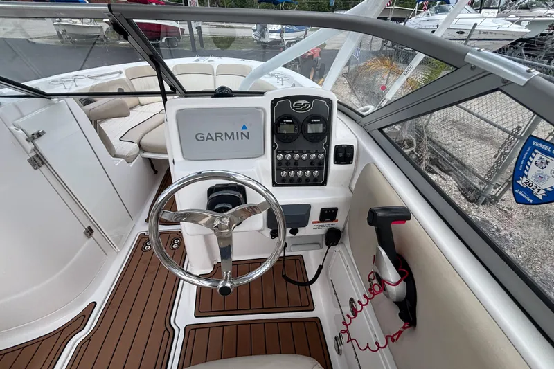 Slide: The Image of 2019 Sea Fox 226 Traveler boat cockpit with Garmin navigation system and steering wheel. - 31