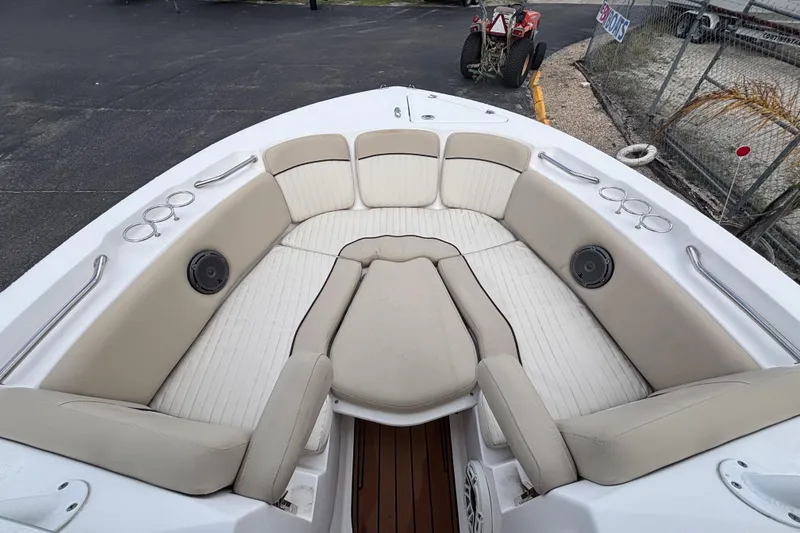 Slide: The Image of 2019 Sea Fox 226 Traveler boat interior with beige seating and cup holders. - 33