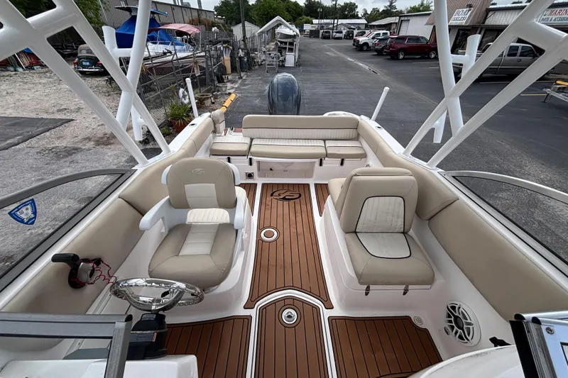 Slide: The Image of 2019 Sea Fox 226 Traveler boat interior with beige seating and wood-style flooring. - 34