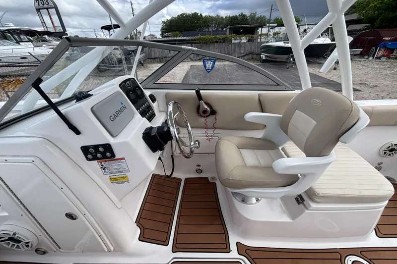 Slide: The Image of 2019 Sea Fox 226 Traveler boat cockpit with Garmin navigation and comfortable seating. - 40
