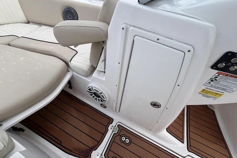Slide: The Image of 2019 Sea Fox 226 Traveler boat interior with cushioned seating and teak-style flooring. - 41