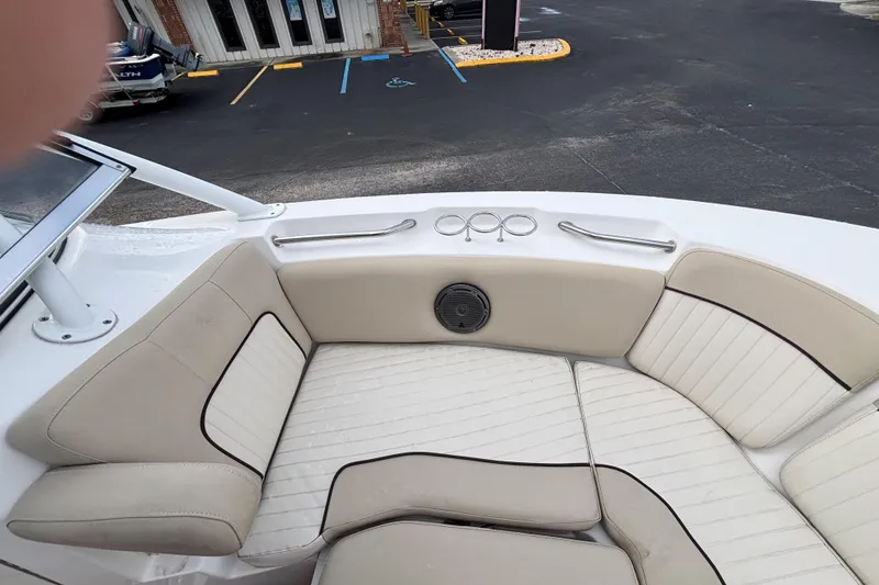 Slide: The Image of 2019 Sea Fox 226 Traveler boat interior with beige seating and cup holders. - 42