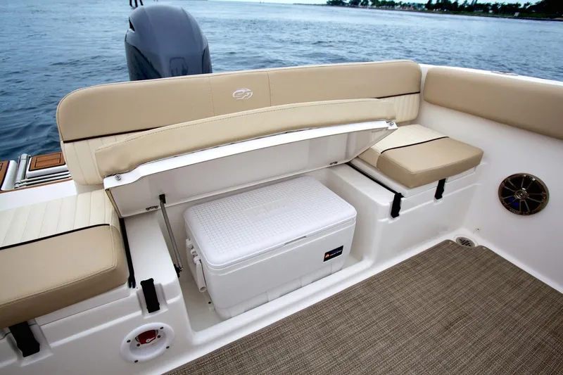 Slide: The Image of Manufacturer Provided Image: 2019 Sea Fox 226 Traveler boat seating area with storage compartment and cooler. - 60