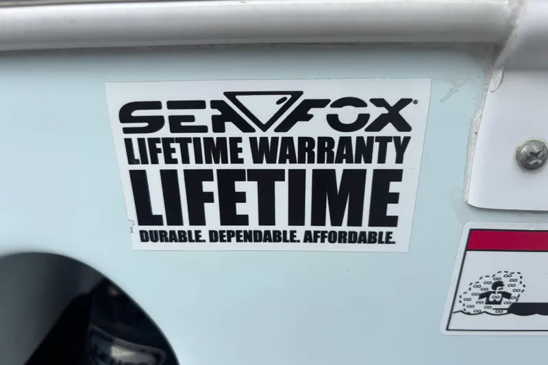 Slide: The Image of Sticker on 2019 Sea Fox 226 Traveler boat, promoting lifetime warranty and durability. - 62