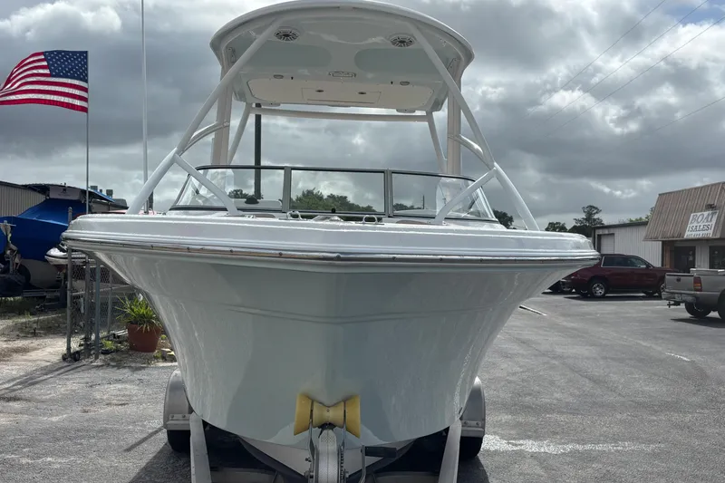 Slide: The Image of 2019 Sea Fox 226 Traveler boat on trailer, American flag in background. - 9