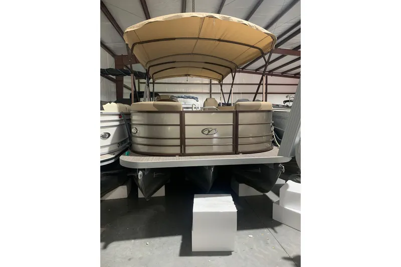 The Image of 2019 Veranda Relax VR25RC pontoon boat with canopy in storage facility. - 0