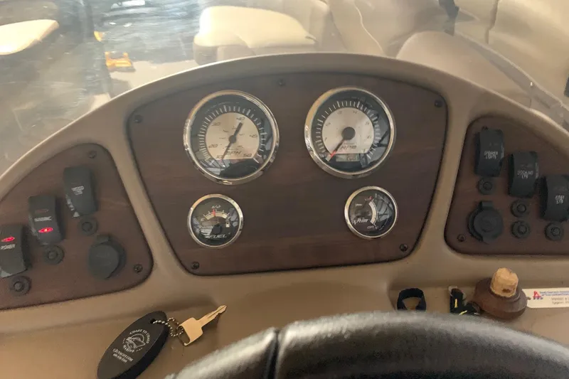 Slide: The Image of Dashboard of a 2019 Veranda Relax VR25RC boat with gauges and controls. - 15