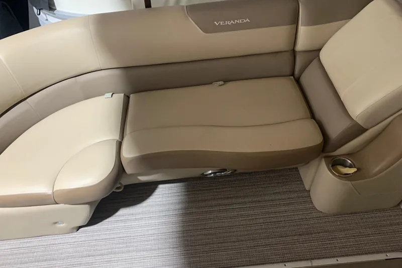 Slide: The Image of 2019 Veranda Relax VR25RC boat seating with beige upholstery and integrated cup holder. - 8