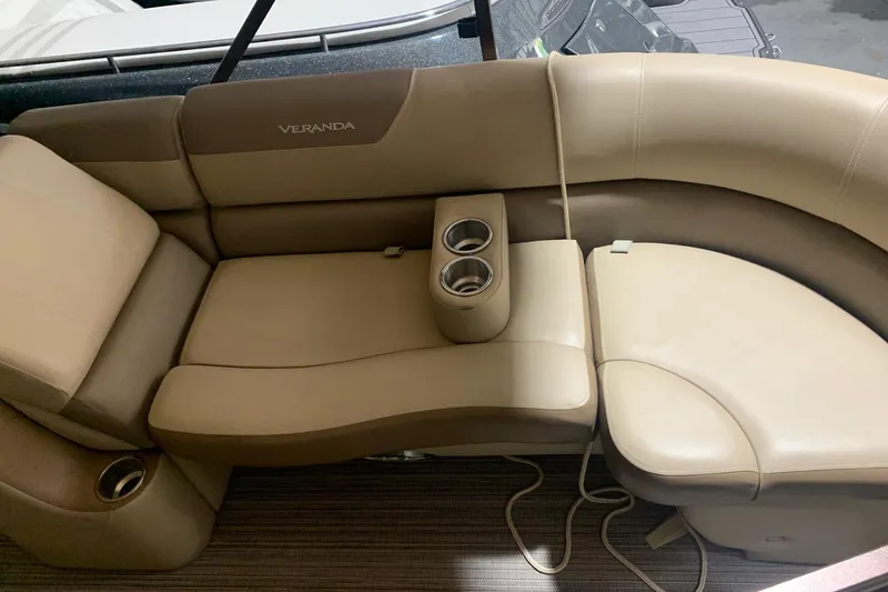 Slide: The Image of Luxurious seating on 2019 Veranda Relax VR25RC pontoon boat with cup holders. - 9