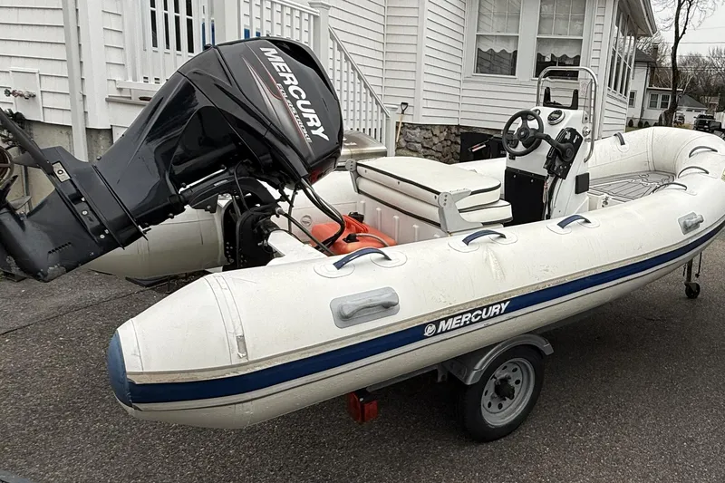 Slide: The Image of 2016 Quicksilver Center Console boat with Mercury outboard motor on trailer. - 2