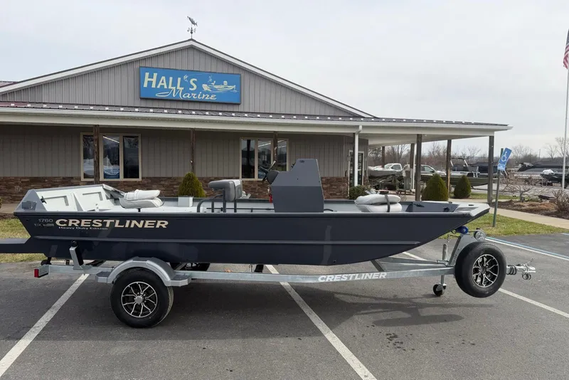 The Image of 2026 Crestliner 1760 Retriever FCC boat on trailer outside Hall's Marine. - 0