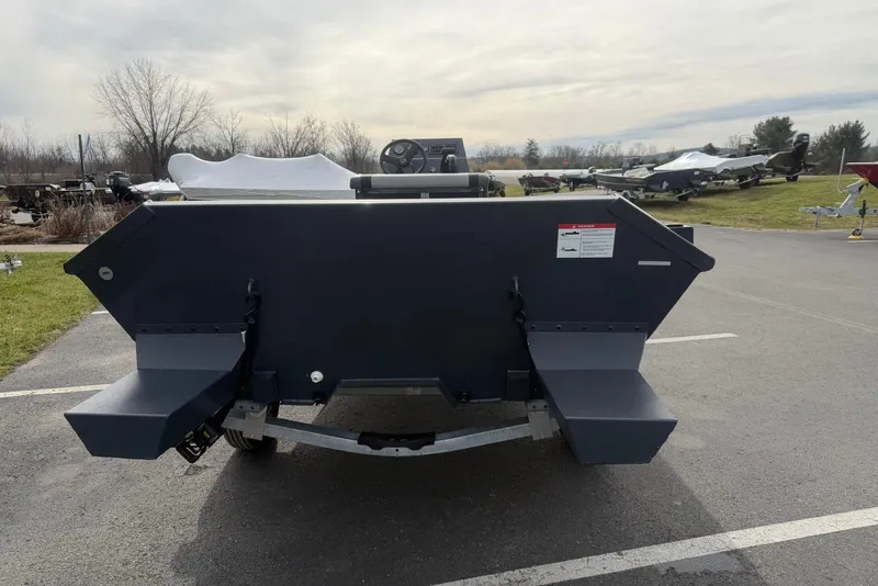 Slide: The Image of 2026 Crestliner 1760 Retriever FCC boat, rear view in outdoor setting. - 2