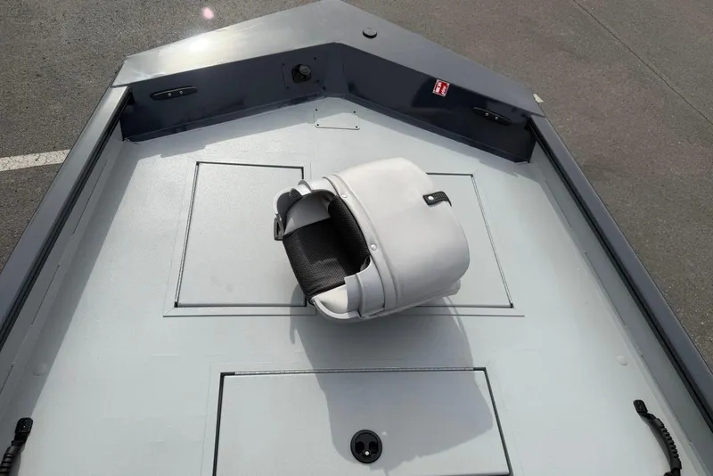 Slide: The Image of 2026 Crestliner 1760 Retriever FCC boat deck with a white seat. - 3