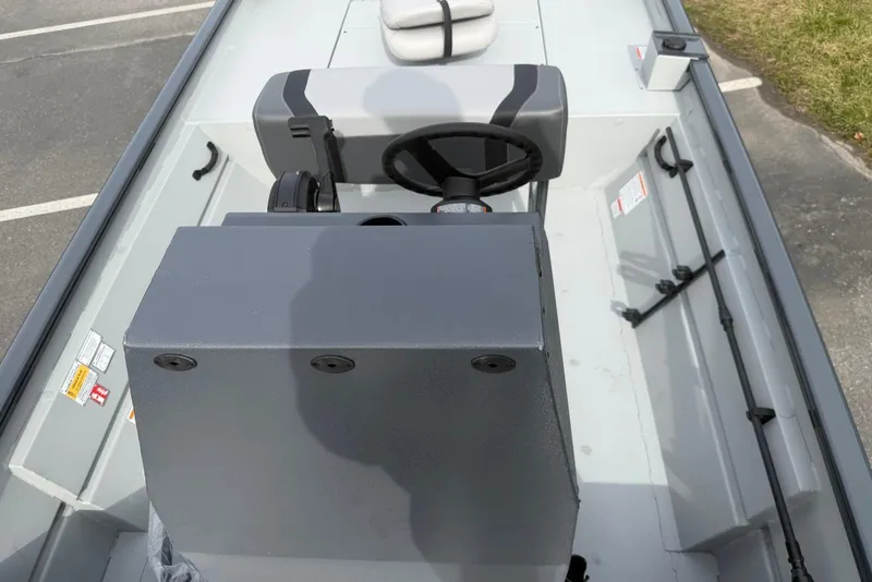 Slide: The Image of 2026 Crestliner 1760 Retriever FCC boat interior with steering console and seating. - 4