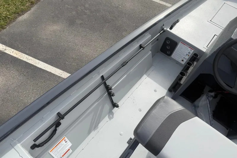 Slide: The Image of 2026 Crestliner 1760 Retriever FCC boat interior with seating and storage compartments. - 8