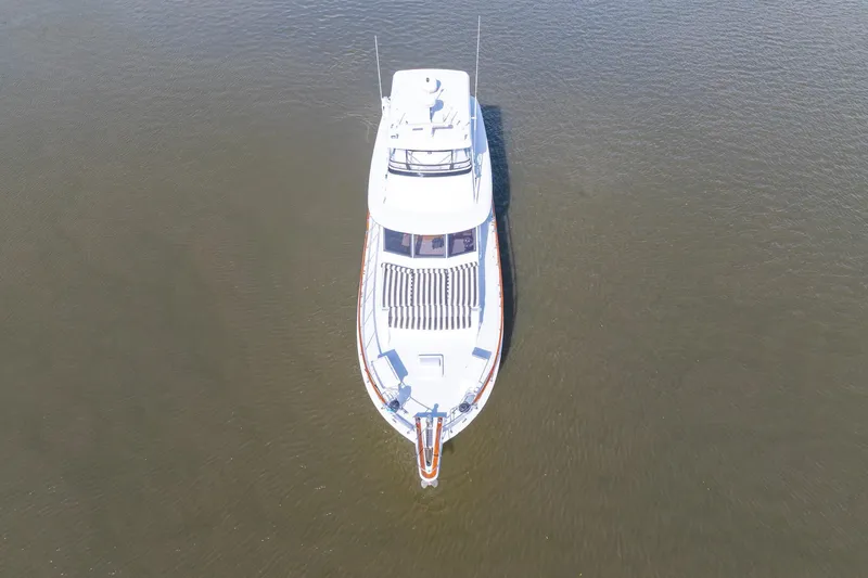 Slide: The Image of Aerial view of 1980 Hatteras 53 Motor Yacht on calm water. - 11