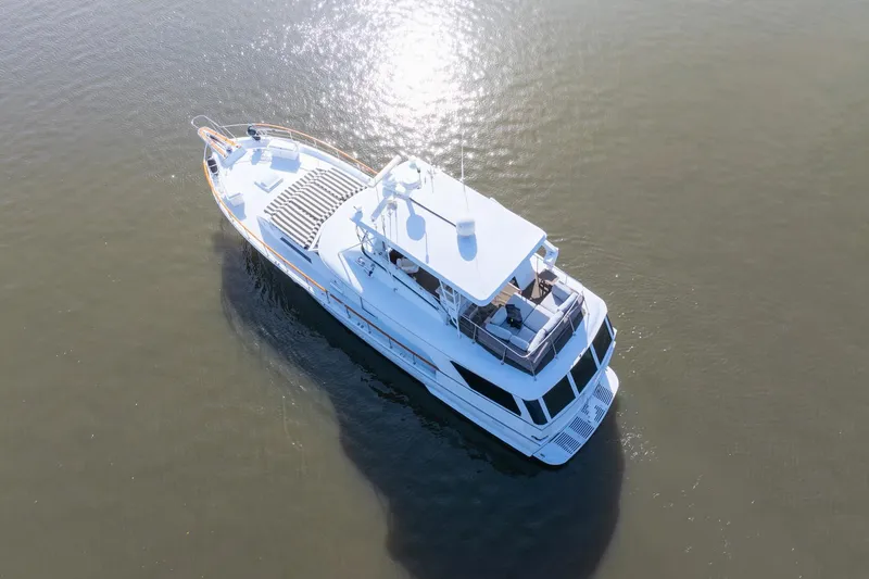 Slide: The Image of Aerial view of 1980 Hatteras 53 Motor Yacht on calm water. - 14