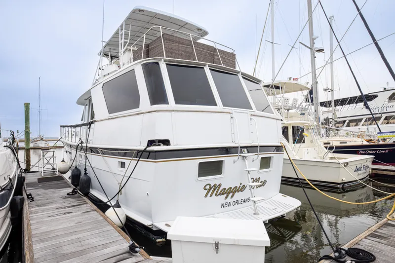 Slide: The Image of 1980 Hatteras 53 Motor Yacht docked in marina, rear view, New Orleans. - 16