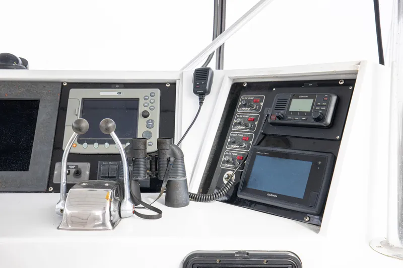 Slide: The Image of Control panel of a 1980 Hatteras 53 Motor Yacht with navigation equipment. - 22