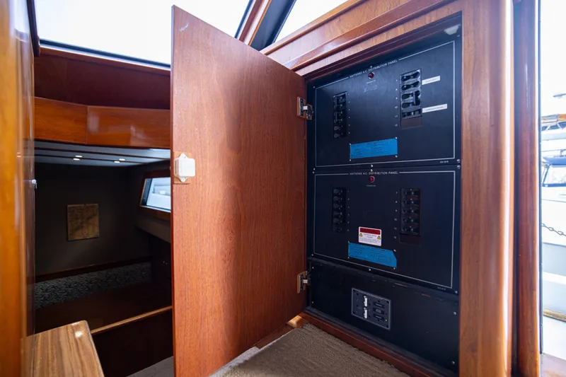 Slide: The Image of Electrical panel inside a 1980 Hatteras 53 Motor Yacht, showcasing circuit breakers. - 53