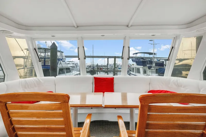 Slide: The Image of Interior view of 1980 Hatteras 53 Motor Yacht with marina backdrop. - 65