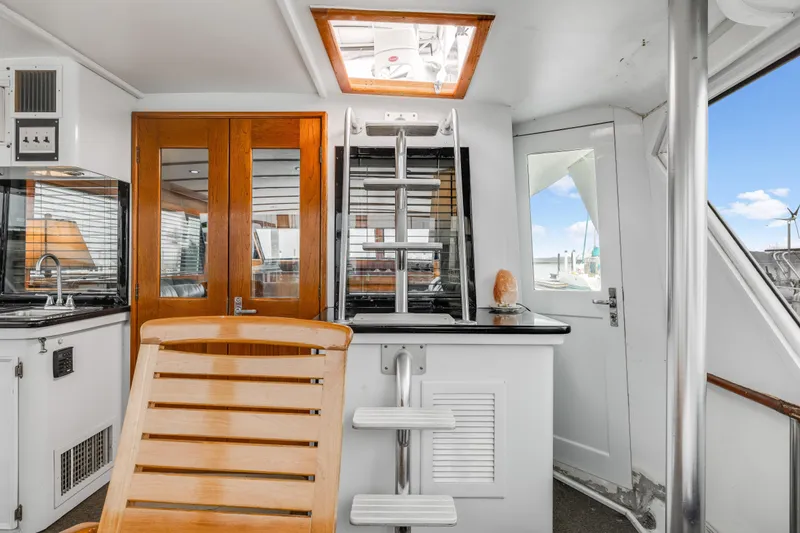 Slide: The Image of Interior of 1980 Hatteras 53 Motor Yacht with wooden accents and modern amenities. - 71