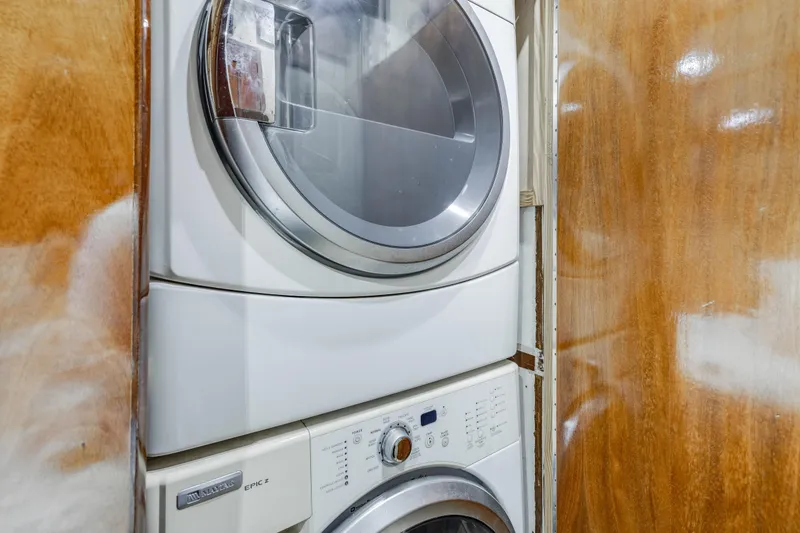 Slide: The Image of Stacked washer and dryer in 1980 Hatteras 53 Motor Yacht, wooden paneling background. - 75