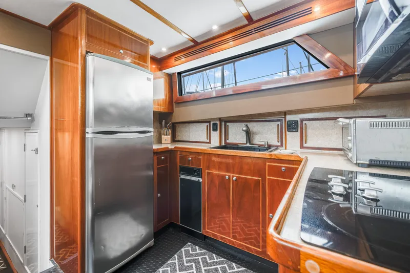 Slide: The Image of Luxurious kitchen interior of a 1980 Hatteras 53 Motor Yacht with modern appliances. - 77