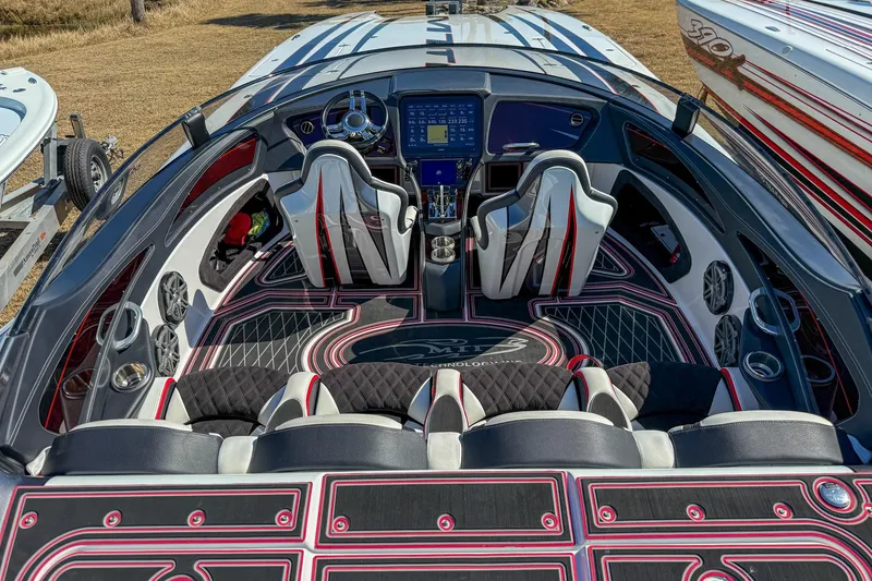 Slide: The Image of Interior of a 2018 MTI 340X boat with modern dashboard and seating. - 12