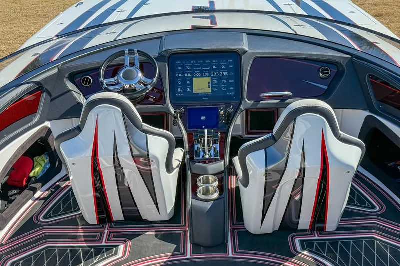Slide: The Image of Cockpit of 2018 MTI 340X boat with modern dashboard and stylish seats. - 13