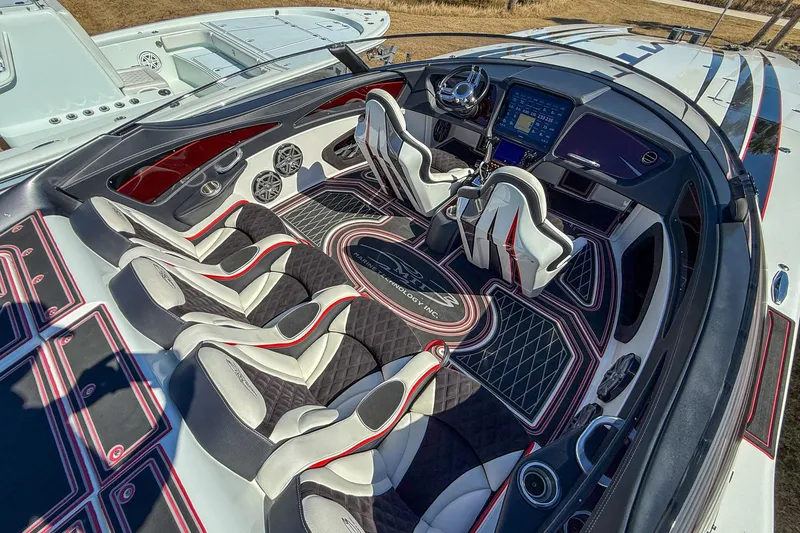 Slide: The Image of Luxurious interior of 2018 MTI 340X speedboat with modern seating and advanced dashboard. - 15