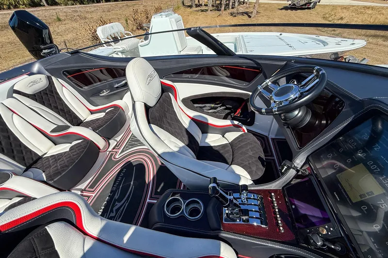 Slide: The Image of Luxurious interior of a 2018 MTI 340X boat with sleek seating and modern controls. - 21