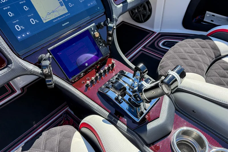 Slide: The Image of Control panel of a 2018 MTI 340X boat with advanced navigation displays. - 24
