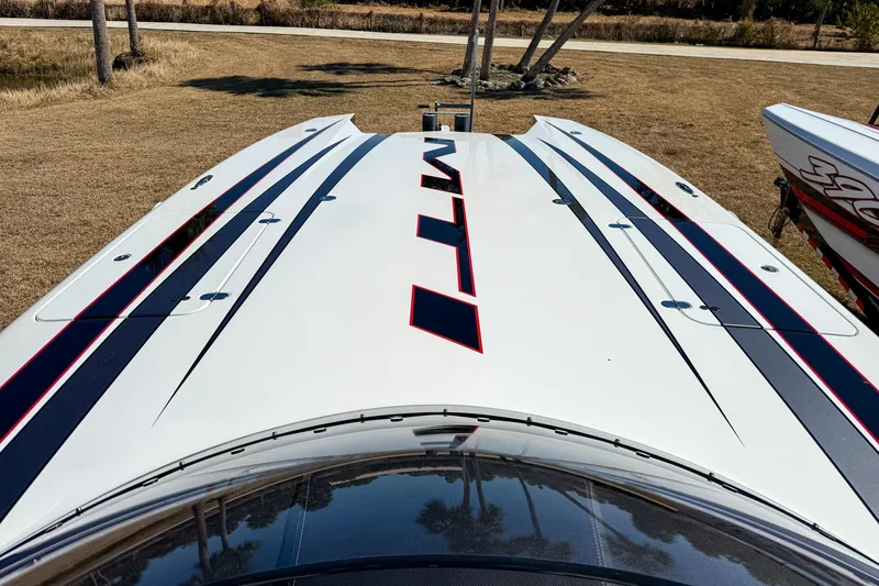 Slide: The Image of 2018 MTI 340X boat with sleek design and bold graphics on display. - 26