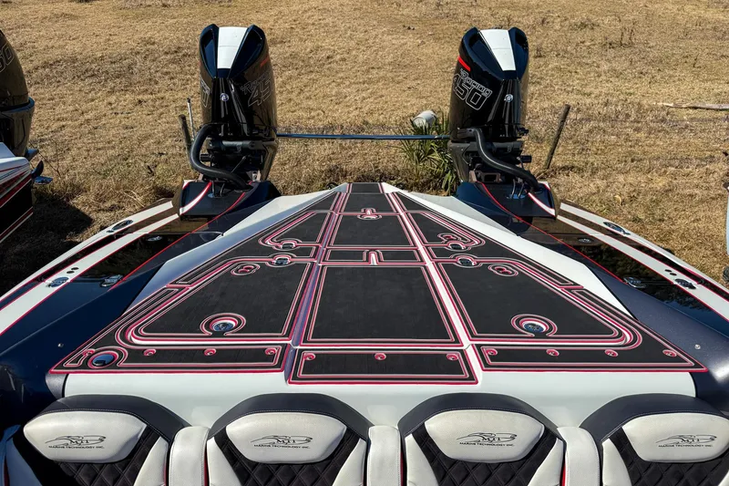 Slide: The Image of 2018 MTI 340X boat with dual engines and custom deck design. - 27