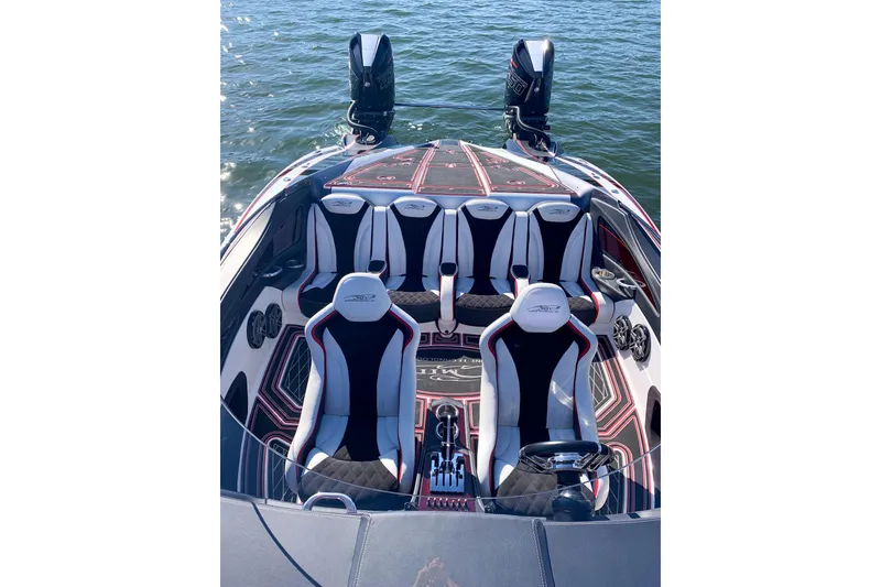 Slide: The Image of Luxury MTI 340X 2018 speedboat interior with stylish seating and dual engines on water. - 30