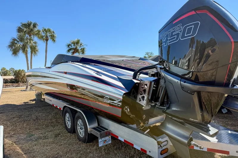 Slide: The Image of 2018 MTI 340X powerboat on trailer with Mercury Racing 450 engine, palm trees in background. - 4