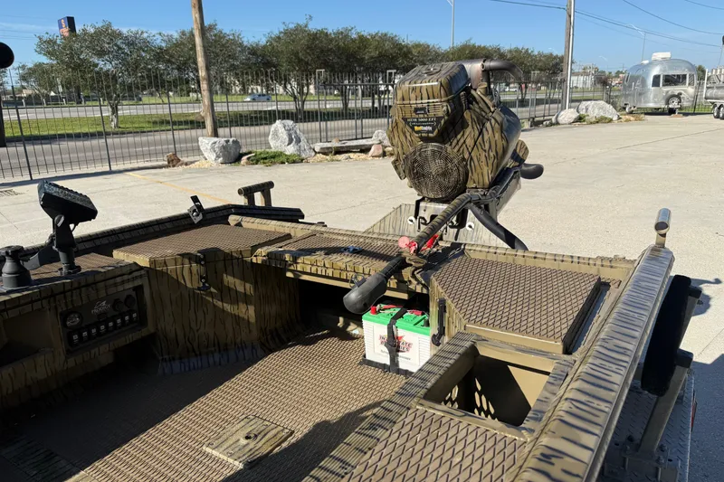 Slide: The Image of Prodigy 1854 boat, 2022 model, featuring a camouflage design and advanced motor setup. - 6