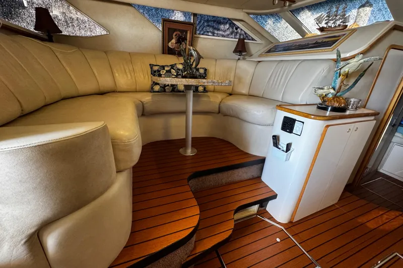 Slide: The Image of Luxurious 1999 Sea Ray 440 Express Bridge interior with plush seating and elegant decor. - 28