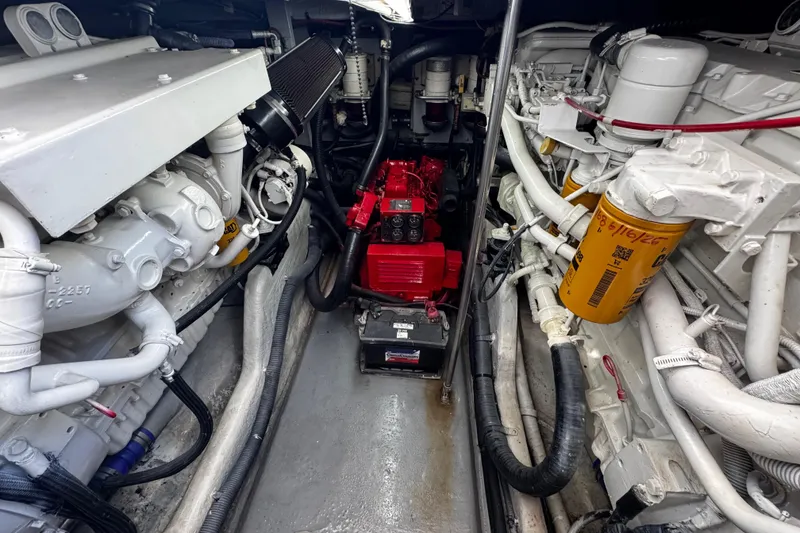 Slide: The Image of Engine room of a 1999 Sea Ray 440 Express Bridge with visible components. - 41