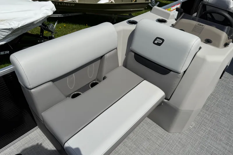 Slide: The Image of 2025 Princecraft Sportfisher 21-2S boat seating with cup holders and sleek design. - 12