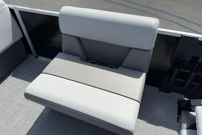 Slide: The Image of 2025 Princecraft Sportfisher 21-2S boat seat with gray upholstery and cup holders. - 15