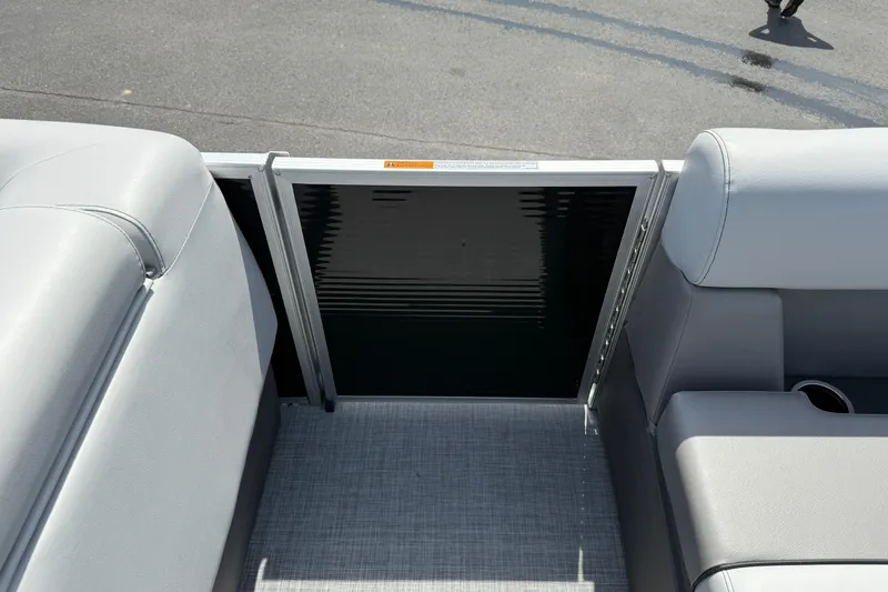 Slide: The Image of 2025 Princecraft Sportfisher 21-2S boat interior with gray seating and flooring. - 16
