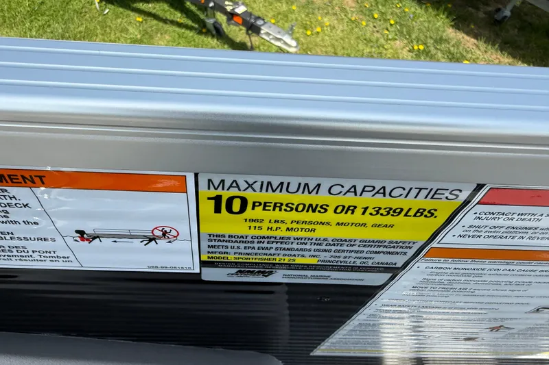 Slide: The Image of 2025 Princecraft Sportfisher 21-2S capacity label: 10 persons or 1339 lbs, 115 HP motor. - 19