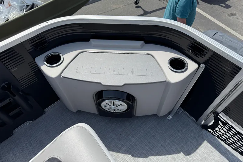 Slide: The Image of 2025 Princecraft Sportfisher 21-2S boat interior with cup holders and speaker. - 8
